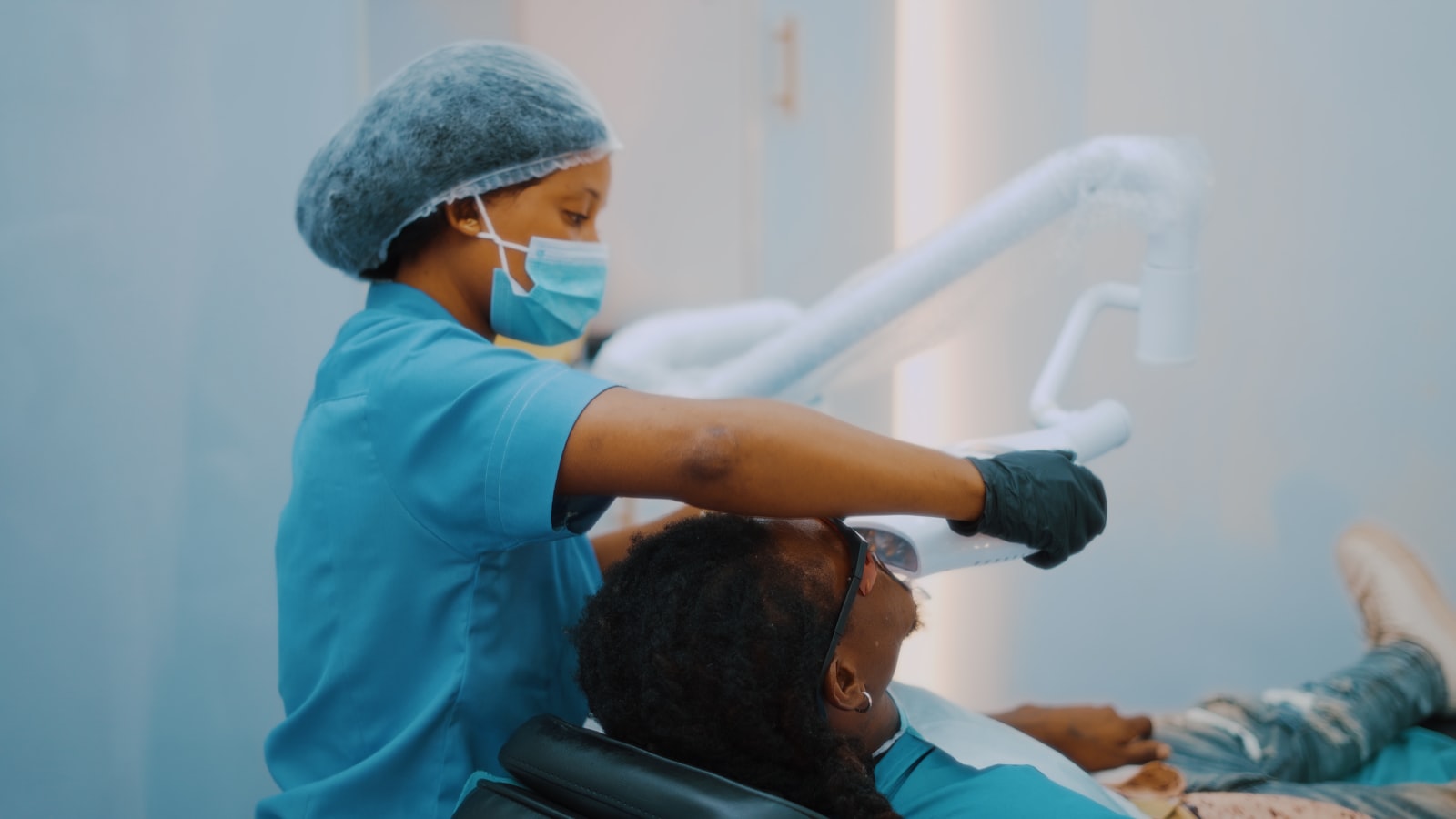 A trained provider using a treatment device in a clinical setting