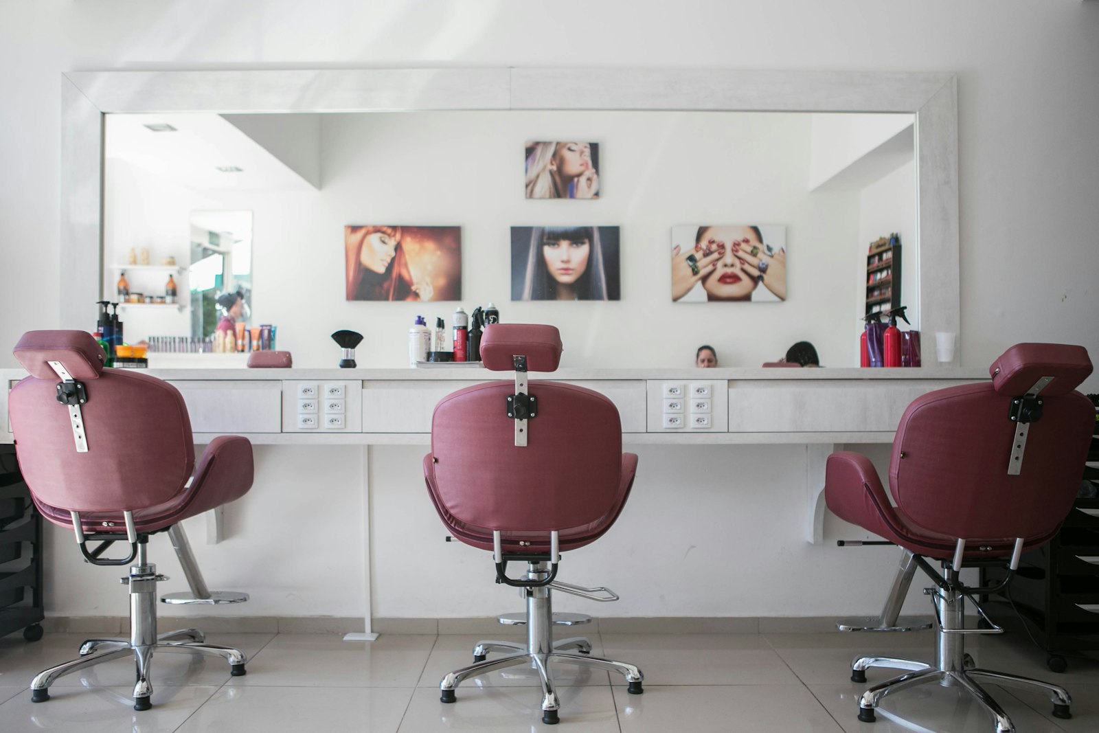 A bright, organized beauty studio with a treatment chair