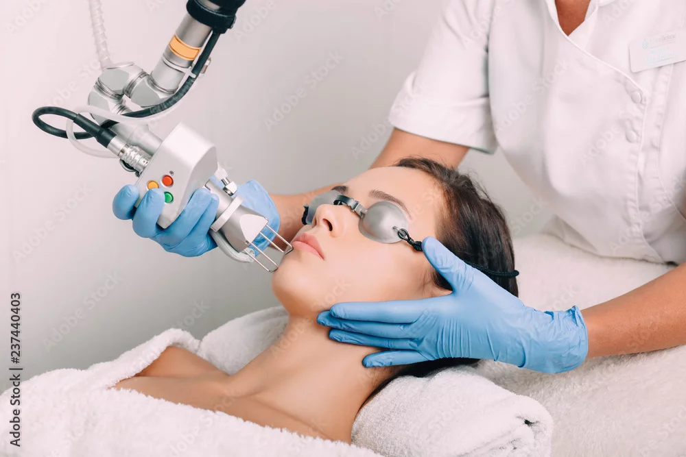 Facial laser treatment with eye protection