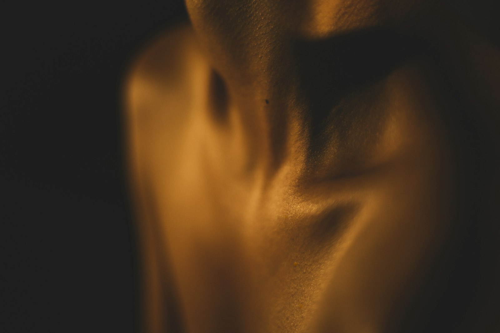 Warm light across a person's shoulder and back